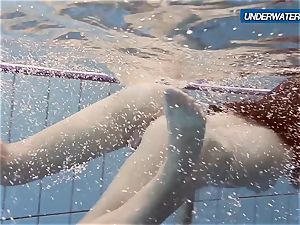 amateur Lastova proceeds her swim
