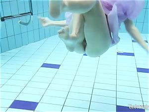 dark-hued haired Aneta in the pool